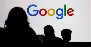People stand in front of a Google logo during a media reception at the Google France headquarters ahead of the Artificial Intelligence Action Summit in Paris, France, 9 February 2025. Reuters/Gonzalo Fuentes/File Photo