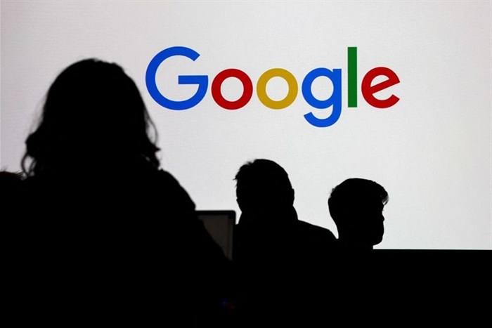 People stand in front of a Google logo during a media reception at the Google France headquarters ahead of the Artificial Intelligence Action Summit in Paris, France, 9 February 2025. Reuters/Gonzalo Fuentes/File Photo