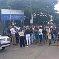 Students protesting at the gates of eThekwini TVET College’s Centec campus in Morningside on Monday, demand an urgent solution to their accommodation crisis. Photo: Tsoanelo Sefoloko / GroundUp