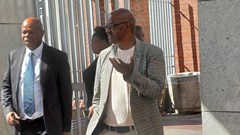 Former Prasa acting CEO Mthuthuzeli Swartz (right) exits the Gqeberha Regional Court with his advocate, Mzwamadoda Mnyani. Photo: Steve Kretzmann / GroundUp