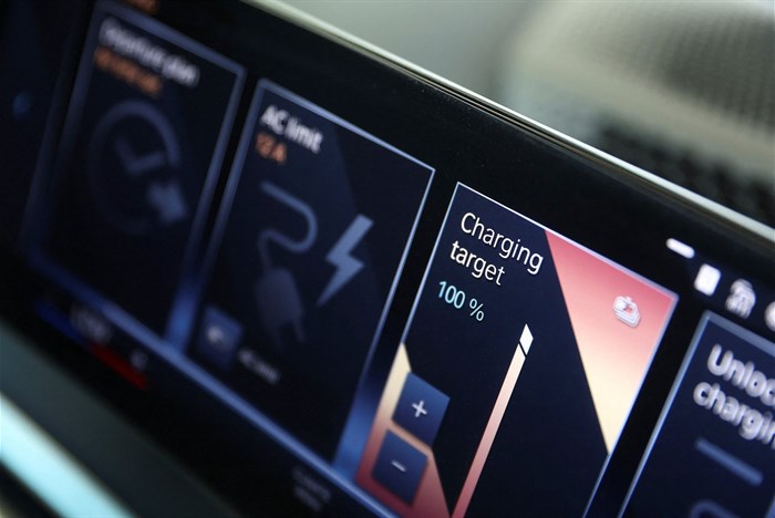 An interior of a BMW iX xDrive40 displaying battery power range, is seen at a BMW dealership in Sandton, South Africa, 27 October 2023. Reuters/Siphiwe Sibeko/File Photo