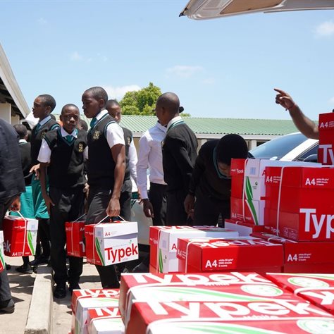 The learners at Groutville School lend a hand in unloading the Typek delivery