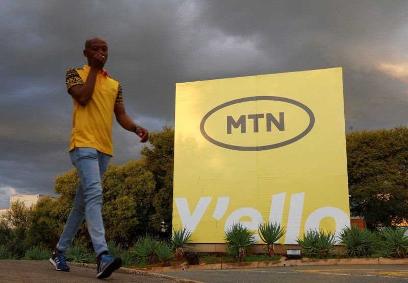 A man walks past an MTN logo outside the company's headquarters in Johannesburg, South Africa, 13 March 2023. Reuters/Siphiwe Sibeko/File Photo