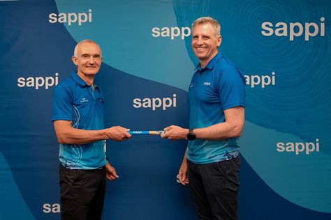 Newly appointed CEO of Sappi Southern Africa Graeme Wild (right) accepting the symbolic baton from outgoing CEO Alex Thiel at a staff event.