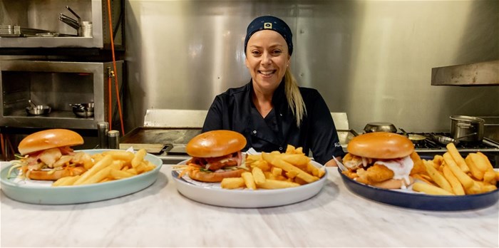 Ocean Basket recently introduced burgers to their menu, with special burger promos running through April and May to the end of May, and the response has been phenomenal. Picture: Alet Kilchenmann, Ocean Basket’s head of food with the three different seafood burgers on offer
