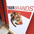 A staff member walks past a branding during a media visit and tour of Tiger Brands' Albany Belville Bakery, in Cape Town, South Africa, 17 October 2024. Reuters/Esa Alexander/File photo