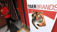 A staff member walks past a branding during a media visit and tour of Tiger Brands' Albany Belville Bakery, in Cape Town, South Africa, 17 October 2024. Reuters/Esa Alexander/File photo