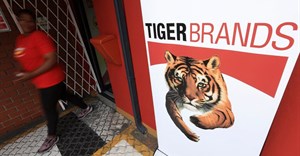 A staff member walks past a branding during a media visit and tour of Tiger Brands' Albany Belville Bakery, in Cape Town, South Africa, 17 October 2024. Reuters/Esa Alexander/File photo