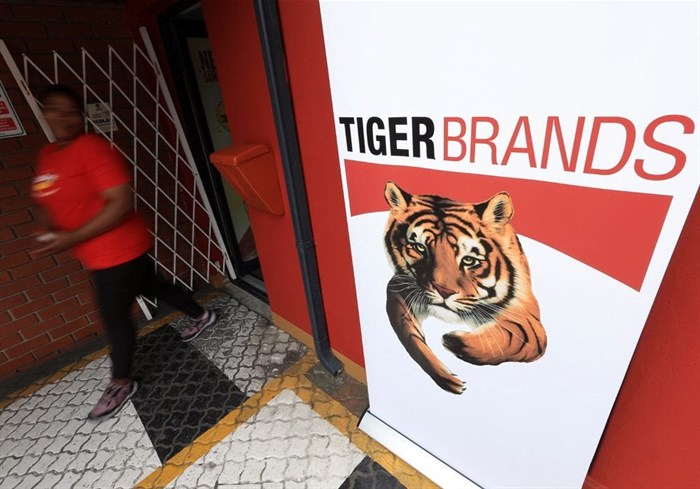 A staff member walks past a branding during a media visit and tour of Tiger Brands' Albany Belville Bakery, in Cape Town, South Africa, 17 October 2024. Reuters/Esa Alexander/File photo