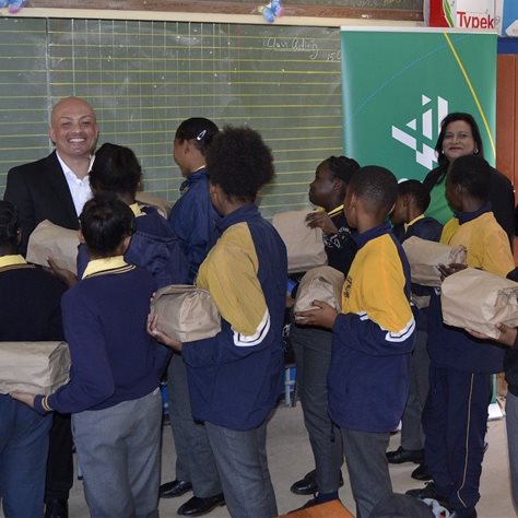 Byron Ah Tow and Arthi Govender from Air Products assisted with handing out the lunch packs to the learners during a recent celebration event at Odin Park Primary in Ennerdale. Ah Tow was a learner at the school