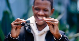 Image supplied. Mr Bright Sello holding the Smart AI Glasses.