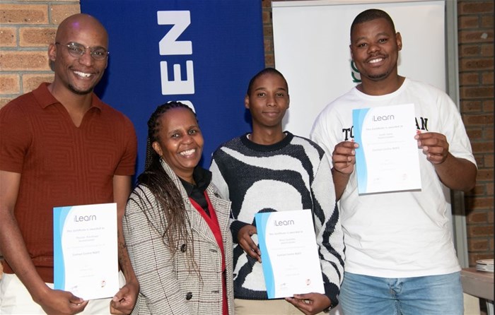 Image supplied. Zoli Mazibuko, iLearn facilitator, and the three proud graduates who secured positions at Engen.