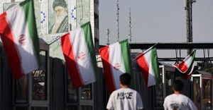 Source: Reuters. People walk near a mural of Iran's Supreme Leader, Ayatollah Ali Khamenei, amid the Iran-Israel conflict, in Tehran, Iran, 23 June, 2025. Majid Asgaripour/WANA (West Asia News Agency).