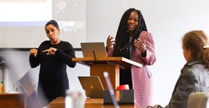 Supplied photo: Sign language interpreter Michelle de Bruyn doing the interpreting as Professor Salome Maswime speaks during a recent event.