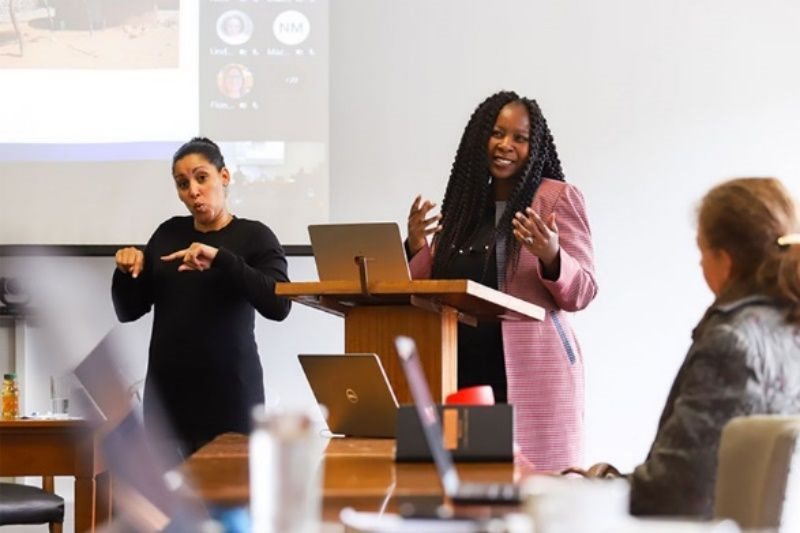 Supplied photo: Sign language interpreter Michelle de Bruyn doing the interpreting as Professor Salome Maswime speaks during a recent event.