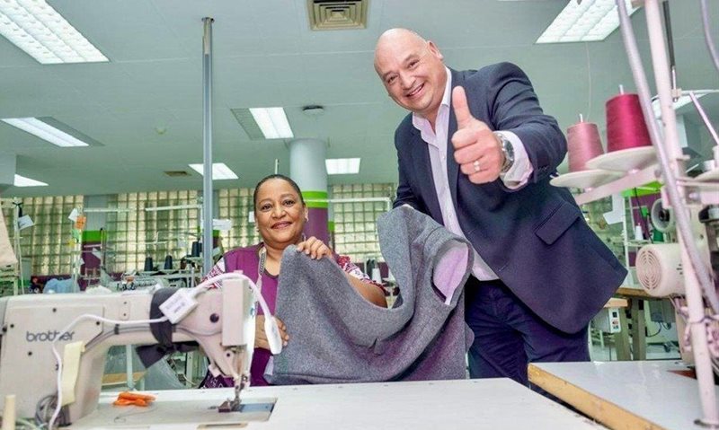 Alderman James Vos, Mayoral Committee Member for Economic Growth with Wilma Engelbrecht, an employee at Prestige Clothing, in Epping. Image supplied
