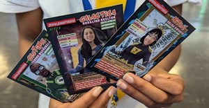 A learner holds up trading cards featuring some of the SuperScientists. This cartoon series, created by Justin Yarrow with a team of local scientists, illustrators and designers, is based on real-life African scientists. Photos: Justin Yarrow/SuperScientists