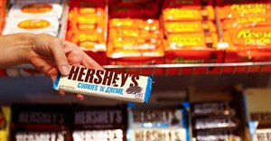An employee shows a Hershey's chocolate bar made in USA in the "American lifestyle" store in Berlin, Germany, 13 August 2018. Reuters/Fabrizio Bensch/File Photo
