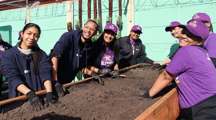 Smiles and soil in action – the BET Software and Hollywood Foundation teams shared sustainable gardening skills with community members