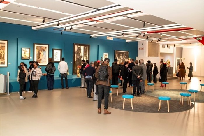 Guests view One and the Many exhibitions at the opening night at Javett-UP - Credit Tatenda Chidora.