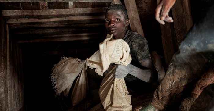 A miner holds a sack of ore as it comes out from the mine shaft at Rubaya coltan mine, near the town of Rubaya, which is controlled by M23 rebels, in the eastern Democratic Republic of Congo. Image credit: Reuters