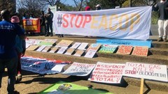 About 80 people gathered in Rosebank to protest against Standard Bank and TotalEnergies’ investment in fossil fuels. Photo: Kimberly Mutandiro