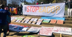 About 80 people gathered in Rosebank to protest against Standard Bank and TotalEnergies’ investment in fossil fuels. Photo: Kimberly Mutandiro