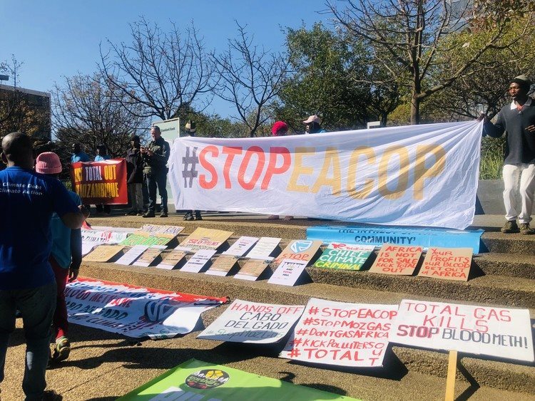 About 80 people gathered in Rosebank to protest against Standard Bank and TotalEnergies’ investment in fossil fuels. Photo: Kimberly Mutandiro