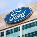 A Ford logo is seen on the Ford Motor World headquarters in Dearborn, Michigan, US, 12 March 2025. Reuters/Rebecca Cook/File Photo