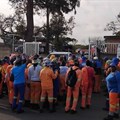Refuse workers block the gates to Durban’s solid waste depot. Photo: Tsoanelo Sefoloko / GroundUp