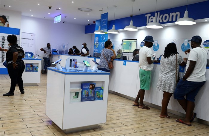 File photo: Customers are served at a branch of South Africa's mobile operator, Telkom, in Johannesburg, South Africa, 2 March 2022. Reuters/Siphiwe Sibeko/File Photo