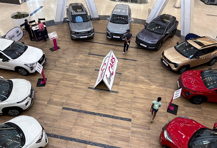 File photo: Customers browse a selection of cars displayed for sale at an entrance of a shopping mall, in Johannesburg, South Africa, 27 August 2025. Reuters/Siphiwe Sibeko/File Photo