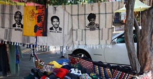 Souvenirs with faces of the late anti-apartheid activists and politicians of South Africa including Nelson Mandela, Steve Bantu Biko and Winnie Madikizela Mandela are displayed at a makeshift stall on Vilakazi Street, the only street in the world which was home to two Nobel Peace Prize winners, President Nelson Mandela and Archbishop Desmond Tutu, in Soweto, South Africa, 22 April 2024. Reuters/Siphiwe Sibeko/File Photo