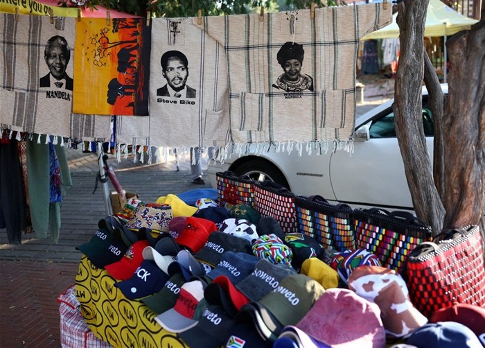 Souvenirs with faces of the late anti-apartheid activists and politicians of South Africa including Nelson Mandela, Steve Bantu Biko and Winnie Madikizela Mandela are displayed at a makeshift stall on Vilakazi Street, the only street in the world which was home to two Nobel Peace Prize winners, President Nelson Mandela and Archbishop Desmond Tutu, in Soweto, South Africa, 22 April 2024. Reuters/Siphiwe Sibeko/File Photo