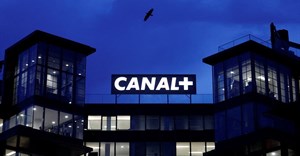 Logos of French TV channel Canal+ are reflected in a puddle in front of the Canal One headquarters of the Canal+ Group in Issy-Les-Moulineaux near Paris, France, 20 February 2025. Reuters/Abdul Saboor/File Photo