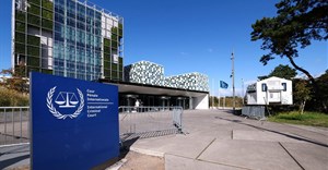 People stand outside the International Criminal Court (ICC), in The Hague, Netherlands, 22 September 2025. Reuters/Piroschka van de Wouw/File Photo