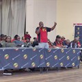 Tando Poni, Samwu’s regional secretary, addresses a crowd of workers on Tuesday, instructing them to return to work. Photo: Johnnie Isaacs / GroundUp