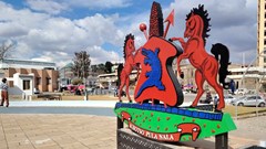Lesotho’s coat of arms at Makoanyane Square in Maseru. Tariff changes could halve the country’s exports to the United States, the International Monetary Fund has warned. Photo: Sechaba Mokhethi / GroundUp