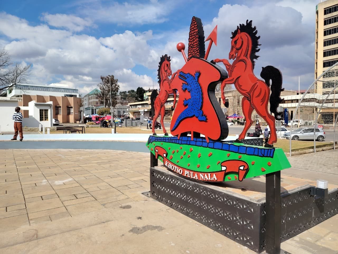 Lesotho’s coat of arms at Makoanyane Square in Maseru. Tariff changes could halve the country’s exports to the United States, the International Monetary Fund has warned. Photo: Sechaba Mokhethi / GroundUp