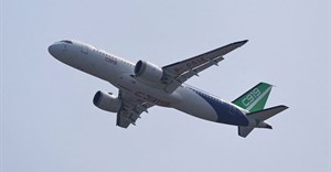A Comac C919 narrowbody airliner flies in the sky at the China International Aviation and Aerospace Exhibition, or Airshow China, in Zhuhai, Guangdong province, China, 12 November 2024. Reuters/Tingshu Wang/File Photo
