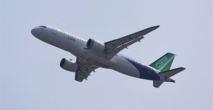 A Comac C919 narrowbody airliner flies in the sky at the China International Aviation and Aerospace Exhibition, or Airshow China, in Zhuhai, Guangdong province, China, 12 November 2024. Reuters/Tingshu Wang/File Photo