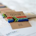 Handcrafted South African flag bracelets are funding a transformation initiative that has already supported over 100 Black-owned tourism businesses (Image supplied)
