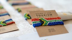 Handcrafted South African flag bracelets are funding a transformation initiative that has already supported over 100 Black-owned tourism businesses (Image supplied)