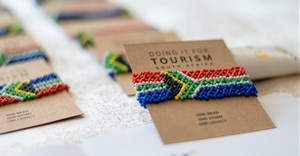 Handcrafted South African flag bracelets are funding a transformation initiative that has already supported over 100 Black-owned tourism businesses (Image supplied)