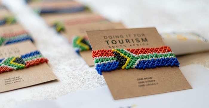 Handcrafted South African flag bracelets are funding a transformation initiative that has already supported over 100 Black-owned tourism businesses (Image supplied)