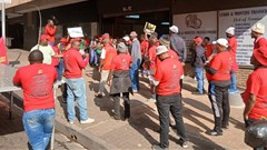 About 50 members of the Food and Allied Workers Union picketed outside the Labour Court on Tuesday. They had applied to interdict South African Breweries (SAB) from retrenching workers. Photo: Silver Sibiya / GroundUp
