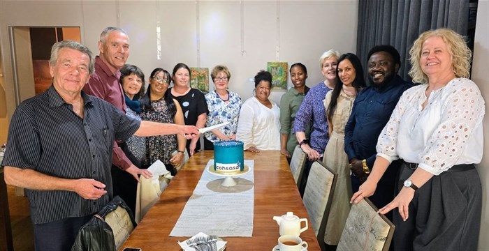 Cohsasa staff gathered around the spectacular 30th birthday cake in a particular order. Moving front left clockwise are staff who have been with the company the longest to the most recent in the front, right hand side. Pictured in “length of service” order are: Giel van Schalkwyk who has the privilege of cutting the cake, chief surveyor | Riel le Roux, quality advisor/surveyor | Marilyn Keegan, communications manager | Roselyne October, travel coordinator | Nadine Joubert, data and help desk operator | Jacqui Stewart, CEO of Cohsasa | Noleen Davids, databank clerk and help desk supervisor | Mtisunge Chiotha, ICT coordinator | Petra Sewing, quality advisor/surveyor | Firdousa Ajouhaar, project manager, quality advisor/surveyor | Leonard Londa, quality improvement manager | Sharon Wilson, accounts manager. Absent on the day: Kefuoe Qwela, databank clerk and help desk operator | Cheryl Adams, knowledge management and systems coordinator | Laetitia Antonides, accounts assistant