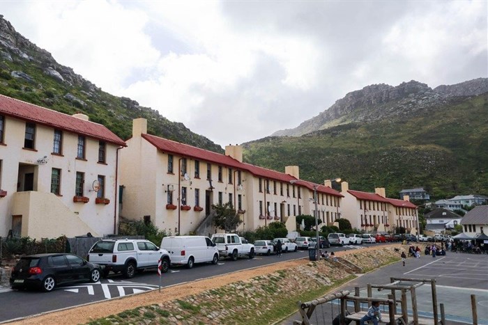 These blocks of flats in Kalk Bay, built in the 1940s, have been inhabited by generations of fishing families. The families are concerned that high water bills are threatening their ability to keep living here. Photos: Liezl Human
