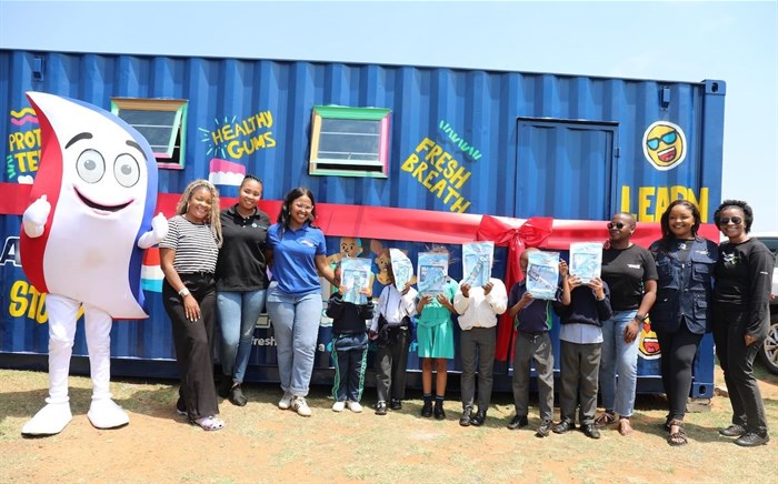 Kena and Haleon team at the official ribbon-cutting of the new library at Kid Maponya Primary School