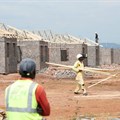 Workers are seen at a construction site at Protea Glen, a township of Johannesburg, South Africa, 19 March 2021. Reuters/Siphiwe Sibeko